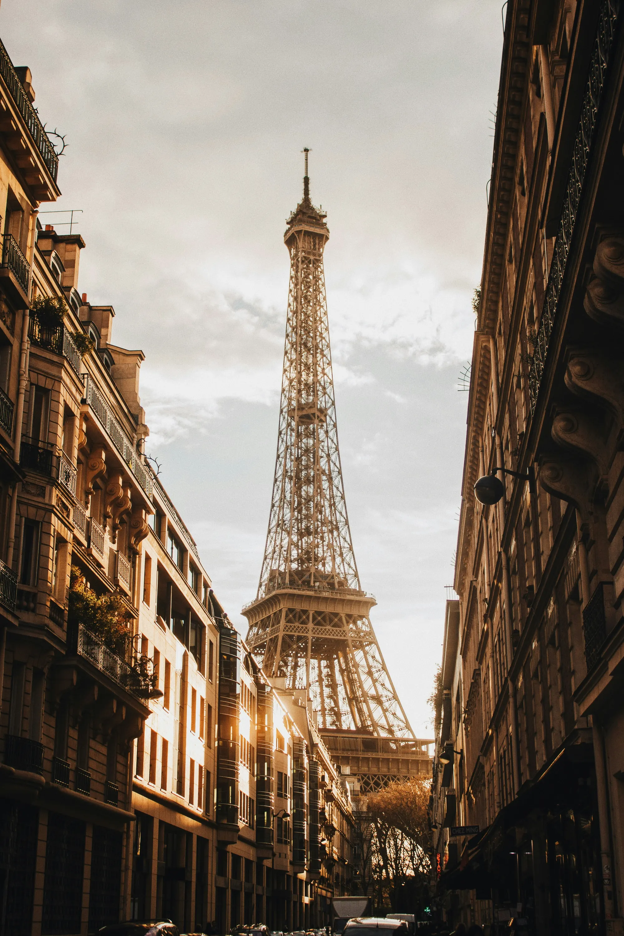 The Eiffel Tower between Parisian façades